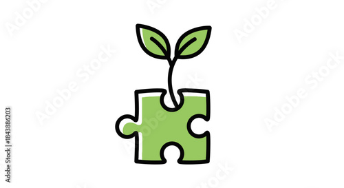 Green plant growing from a puzzle piece