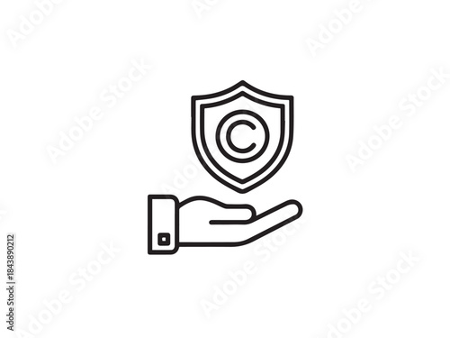Hand holding a shield with copyright symbol representing intellectual property protection