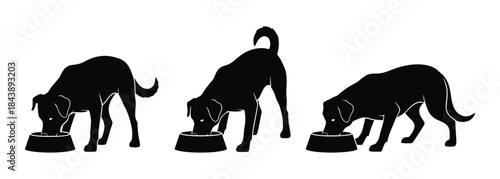 Three black dog silhouettes eating from bowls