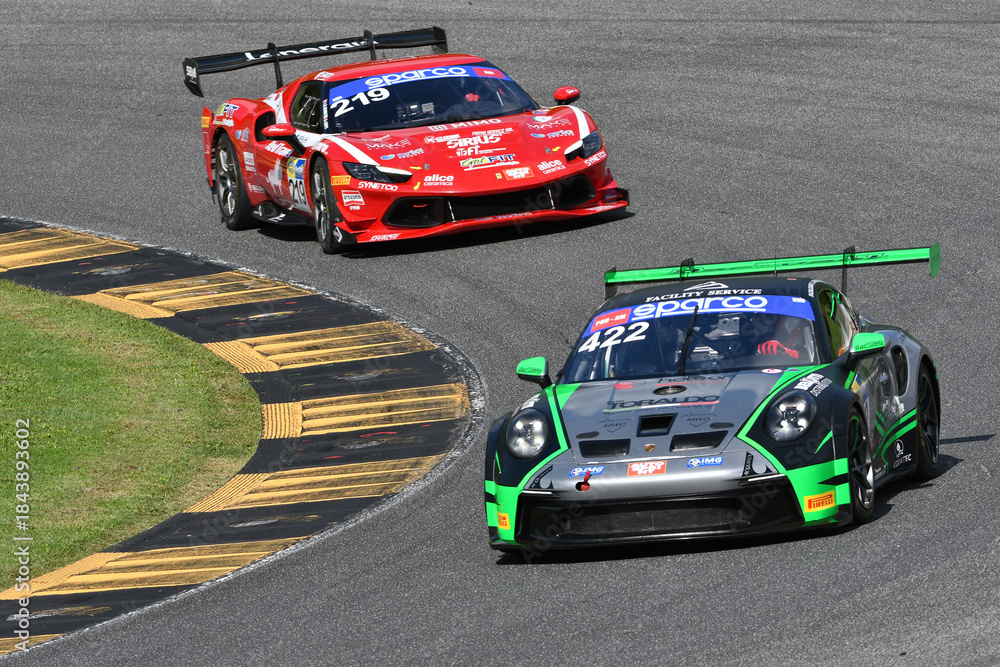 Fototapeta premium Scarperia, Italy - September 14th 2025: Porsche 911 GT3 Cup (992) of team RACEVENT in action during Italian Championship GT Endurance race event at Mugello Circuit.