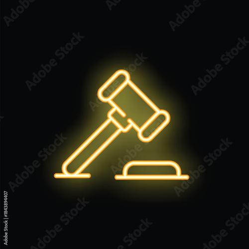 Yellow neon gavel striking surface, glowing on black background, representing legal system, law and justice