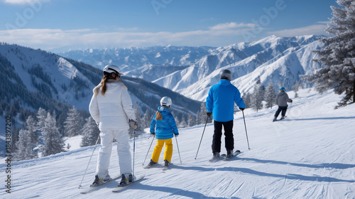 Family skiing together on wide mountain piste, joyful parents teaching children to ski, snow-covered alpine landscape, blue sky, bright winter day, realistic travel photography, ba