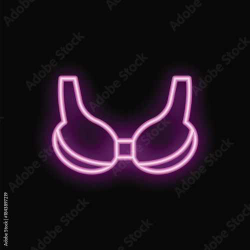 Neon bra sign illuminating a black wall with pink light