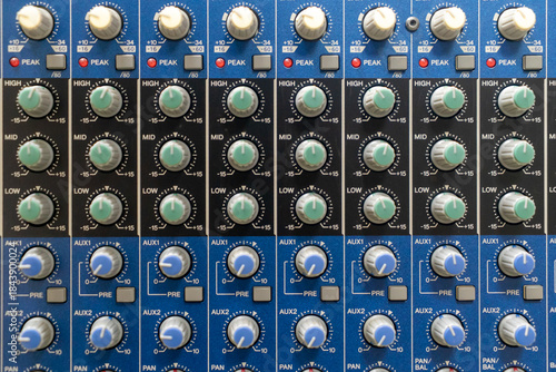 Audio Mixer Control Panel with Knobs and Faders