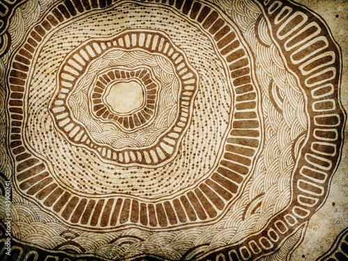 Abstract grunge background with hand drawn concentric circles and organic tribal patterns on old paper texture