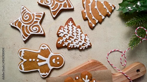 Holiday background. Christmas gingerbread cookies with icing in a plate, festive food