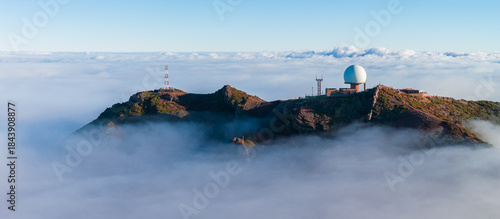 Photos Aerial view shows Pico do Arieiro, Madeira, with white radar dome and towers on a rugged ridge