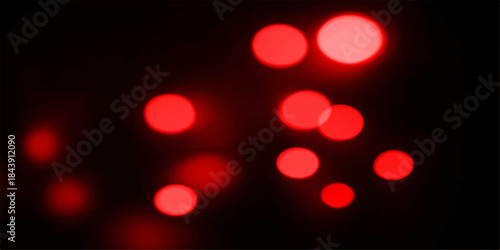 Bright red Christmas lights bokeh pattern glow at night for holiday celebration
