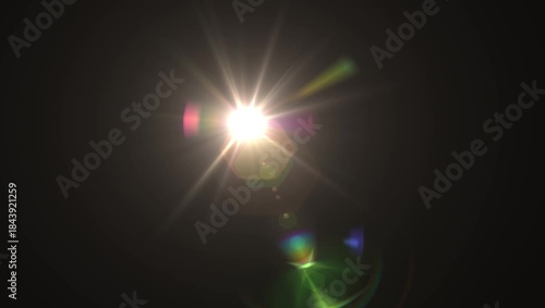 Optical lens flare with warm bokeh effects, sunbeam shining brightly, dark background.