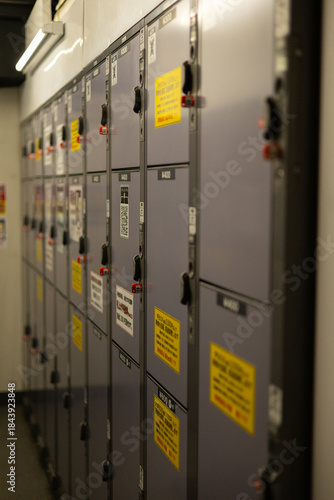 Photography A row of lockers with yellow stickers on them in Tokyo