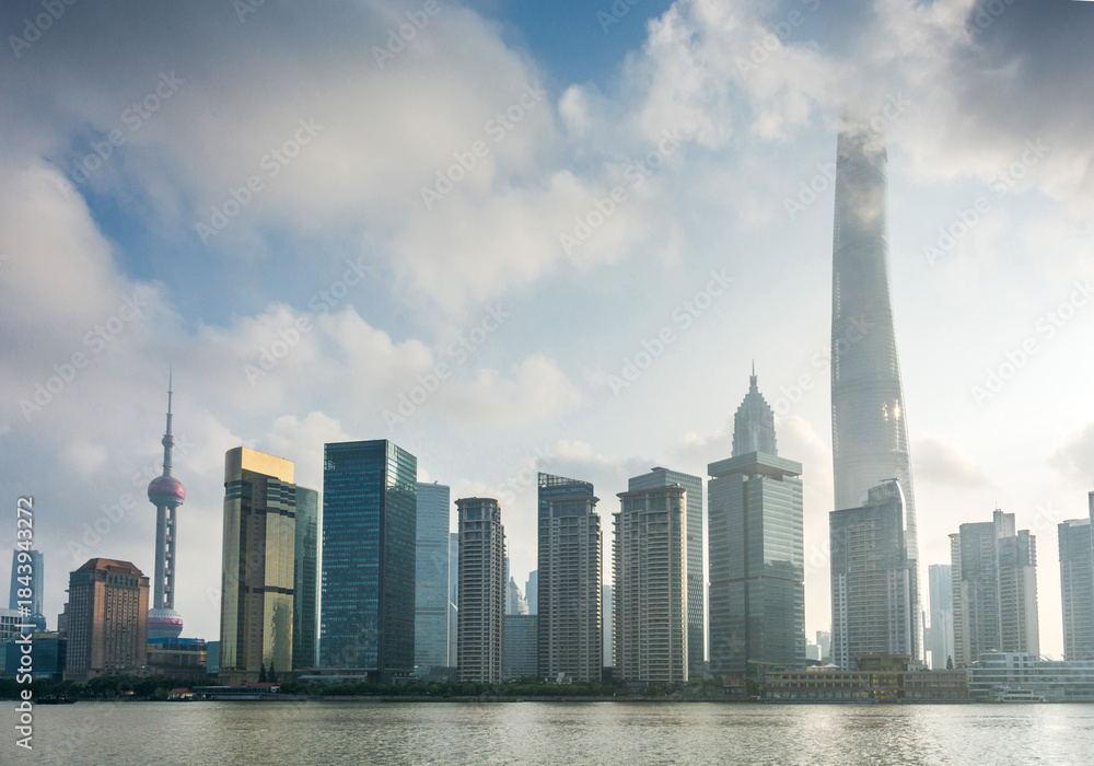 Fototapeta premium Modern Skyscrapers Along the Riverfront in Urban Area