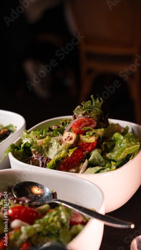 Fresh Green Salad with Cherry Tomatoes Served in White Bowl