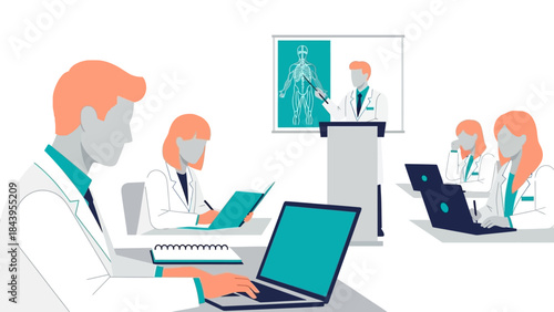 Medical team in conference room for anatomy presentation with laptops and charts