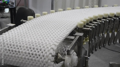 Modular belt rotary conveyor. Continuous movement system. Transportation of materials or products. Conveyors for moving objects. Production manufacture. Moving industrial belt. Connected plastic links