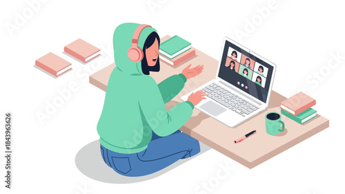 Virtual meeting from home: woman in hoodie engaging online with laptop and headphones