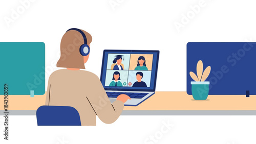 Virtual meeting with colleagues on laptop in minimalist office setting