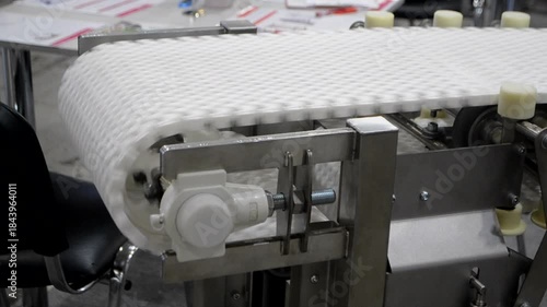 Modular belt rotary conveyor. Continuous movement system. Transportation of materials or products. Conveyors for moving objects. Production manufacture. Moving industrial belt. Connected plastic links