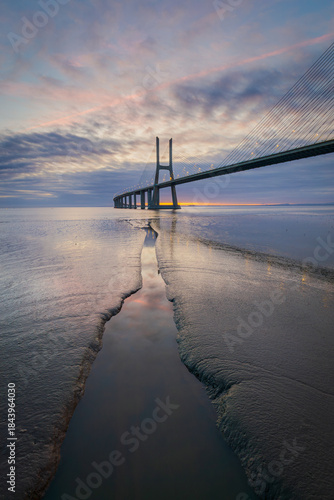 Vasco da Gama bridge over tagus river in Lisbon, Portugal, before sunrise