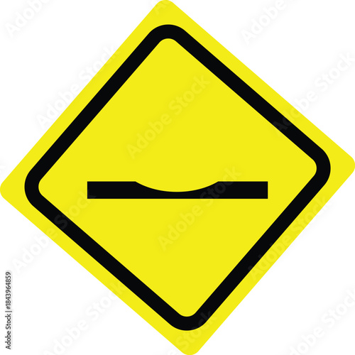 Road sign warning of road bump ahead