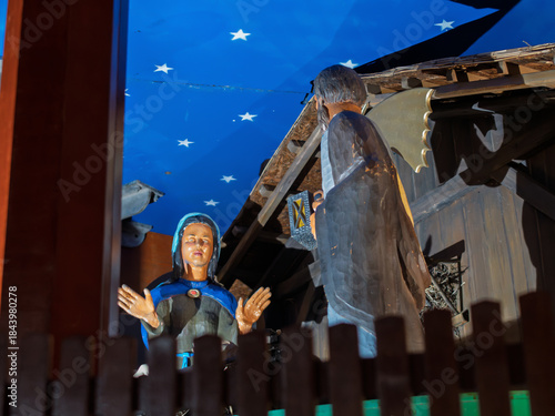 Intricate Wooden Religious Figurines Beneath Starry Ceiling