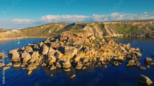 Aerial drone view of Malta nature countryside. Cliffs, sea, rocks. Ghain Tuffieha beach. Malta island