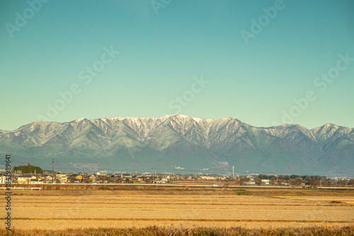 countryside landscape with  mountains,snow and village