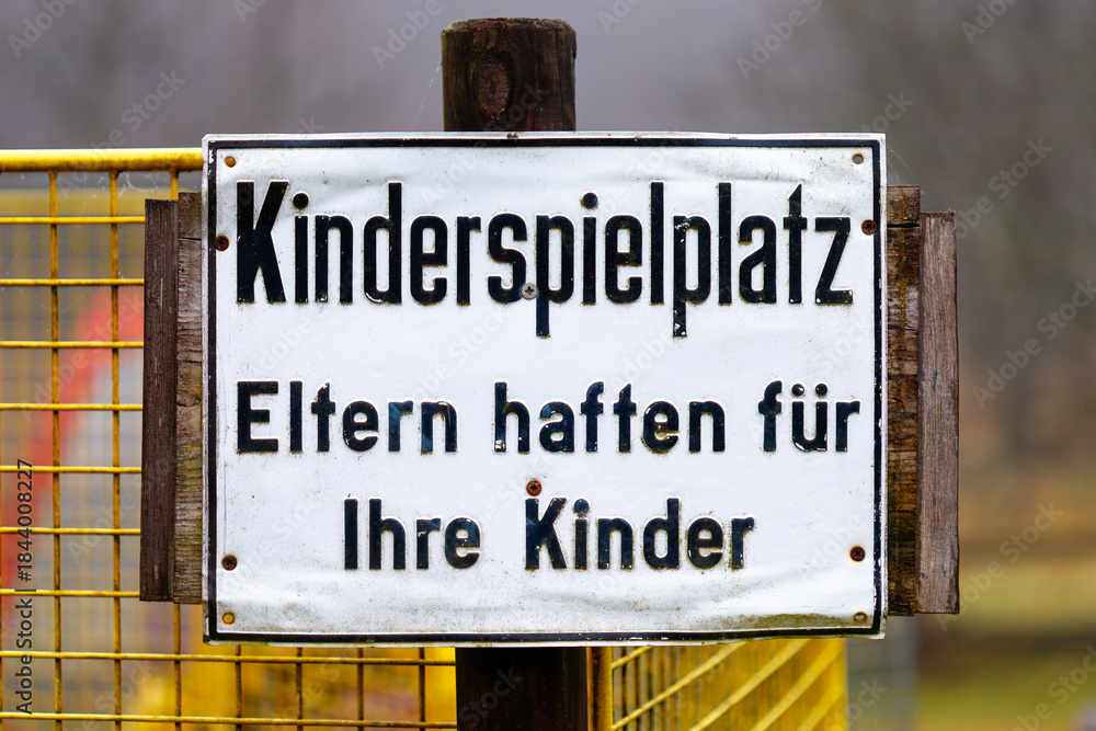 Fototapeta premium German playground warning sign emphasizing parental responsibility