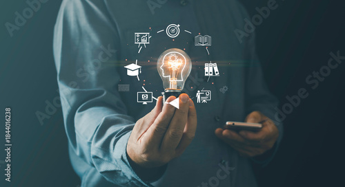Innovative learning knowledge-development concept with creative thinking, modern digital education person holding glowing light bulb surrounded icons representing training, e-learning, development