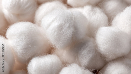 Soft, fluffy, white cotton balls showcasing their fibrous texture and smooth appearance