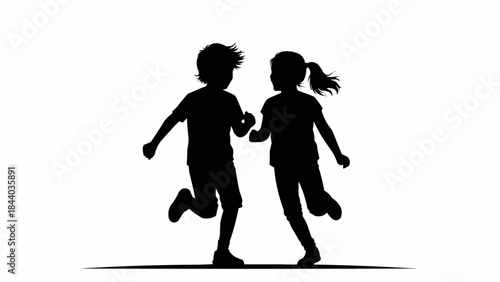 Silhouette of two children running together happily.