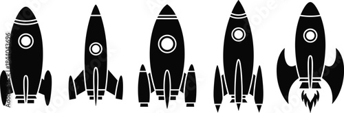Five black silhouette rocket ships with white circular windows and fins spaceship space