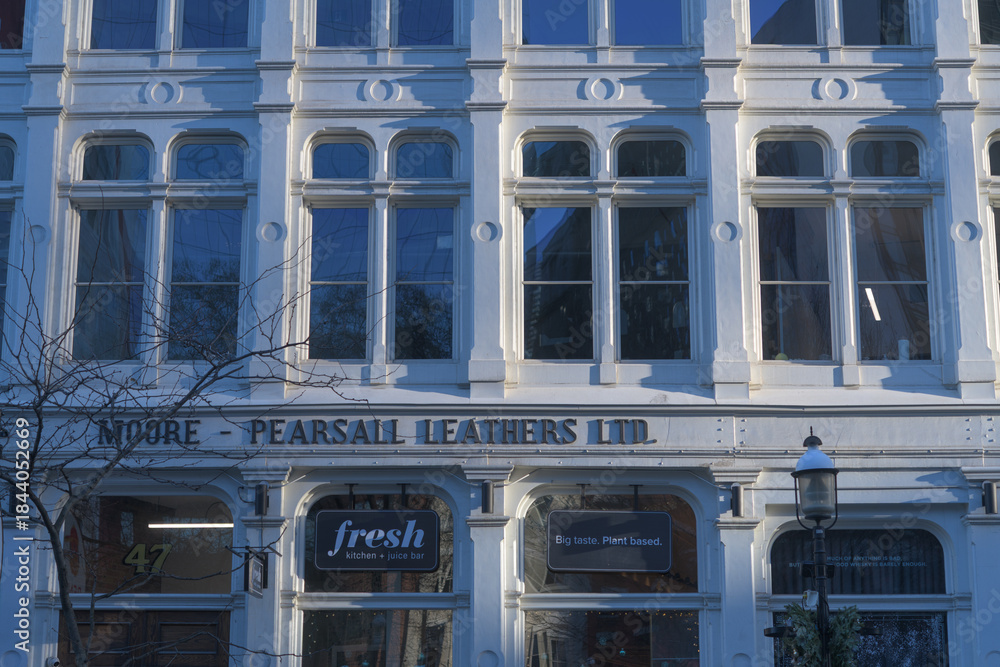 Fototapeta premium exterior building facade and sign of Fresh Kitchen + Juice Bar located at 47 Front St E, Toronto