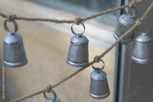decorative rustic bells tied to a twine cord