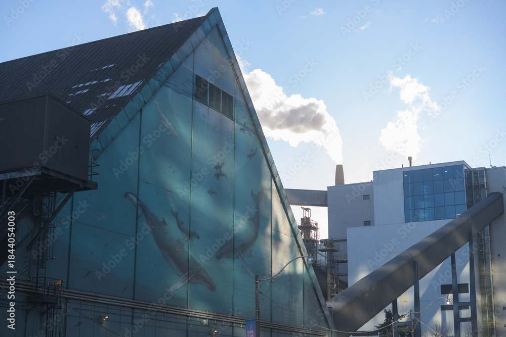 Naklejka premium whale mural on exterior of gable‑roofed industrial shed or A‑frame warehouse at Redpath Sugar Refinery located at 95 Queens Quay E, Toronto