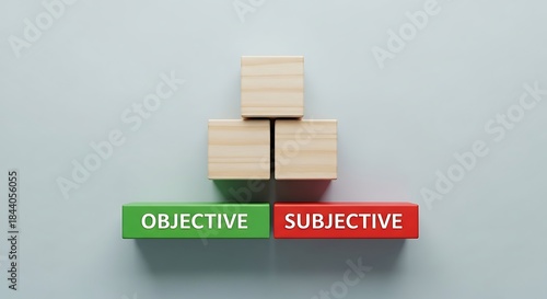 Wooden blocks contrast objective green and subjective red concepts on light background