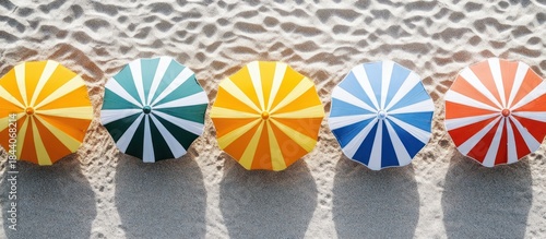 Colorful beach umbrellas on sand. Summer vacation