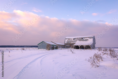 Quiet country winter farm scene at sunset 