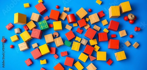 Vibrant painted wooden blocks and toys scattered on a bright blue background,  playful,   game