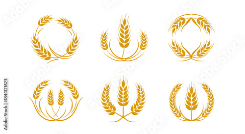 Six golden wheat ear designs and logos, symbolizing agriculture, harvest, and natural food products, isolated on a white background.