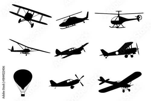 Collection of various airplanes and helicopters in silhouette on