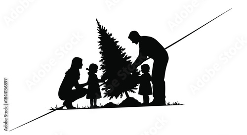 Family silhouette decorating a Christmas tree together outdoors in winter.
