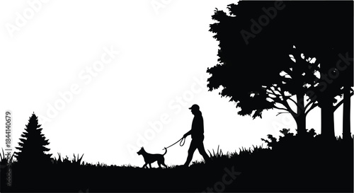 Silhouette of a person walking a small dog on a leash in a grassy park with trees.