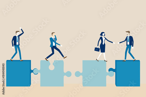 Business people connecting puzzle pieces representing collaboration and success