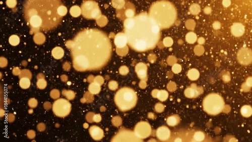 Golden glowing orbs dance in dark space
