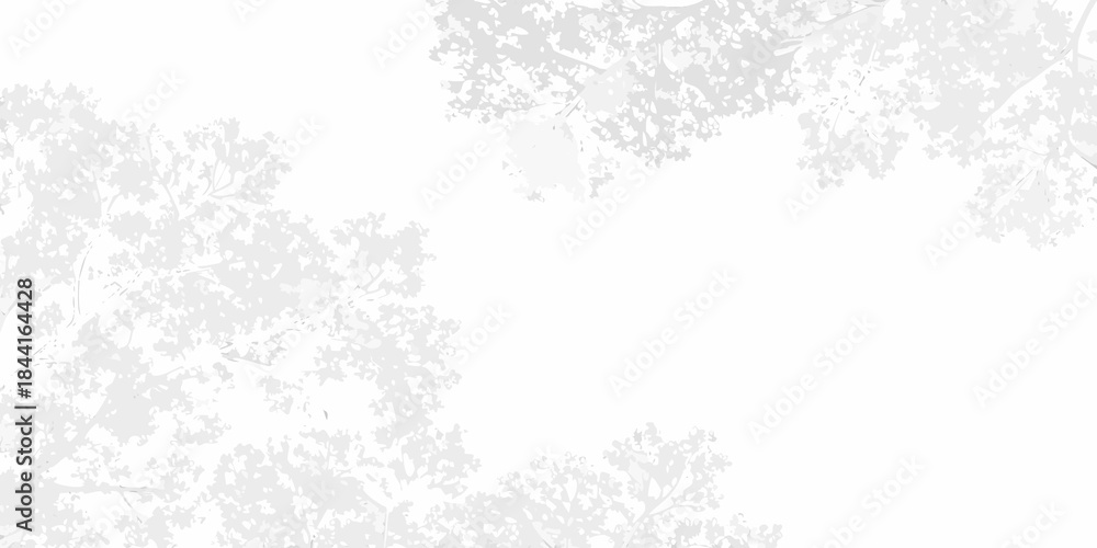 Fototapeta premium Delicate tree branches forming a soft ethereal frame around a white space