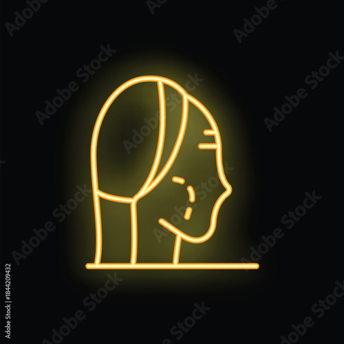 Yellow neon sign depicting a woman receiving a facial treatment, highlighting skincare and beauty