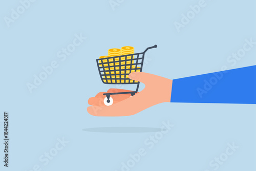 dollar gold coins in shopping cart or trolley in businessman hand