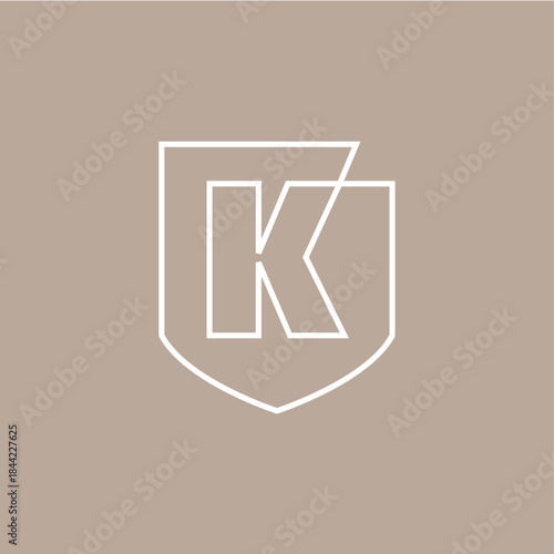 k letter shield protection security logo vector icon illustration