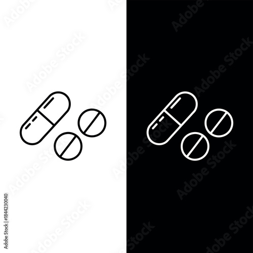 Clean line of pharmaceutical pills and capsules shown on stark black and white backgrounds offering clear visual representation for medical themes