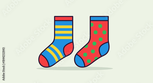 Two mismatched socks one bluestriped one reddotted against a light backdrop